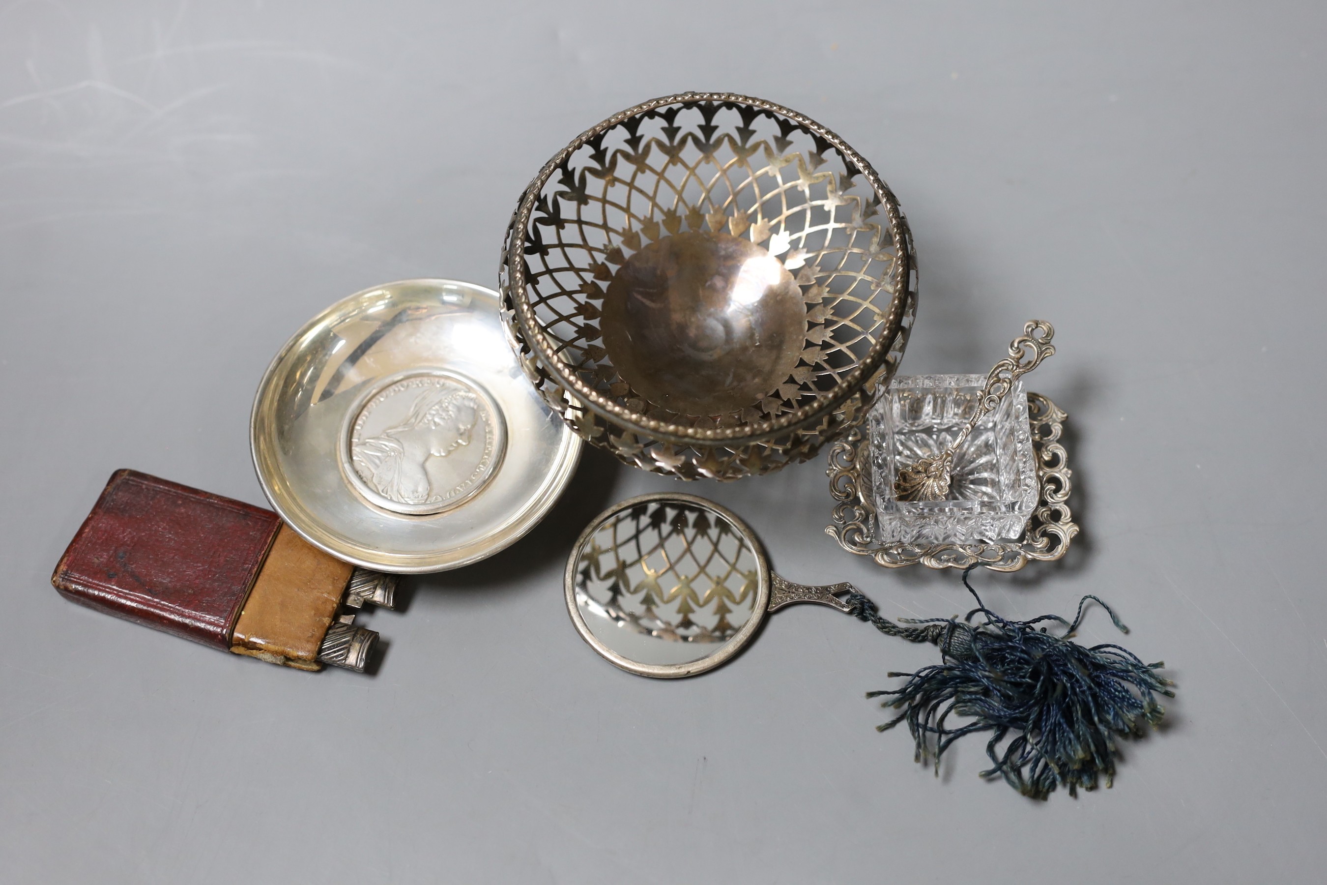 A cased Georgian silver and mother of pearl mounted campaign knife and fork, a pierced silver bonbon dish and other minor silver.